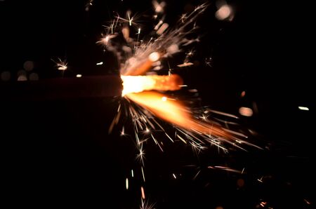 Burning sparkler isolated on black background in darknessの写真素材