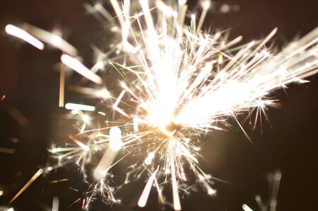 Burning sparkler isolated on black background in darknessの写真素材