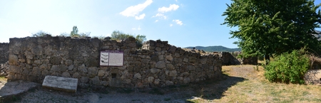 stone wall of a ruined castle, the ruins, trees and blue skyの写真素材