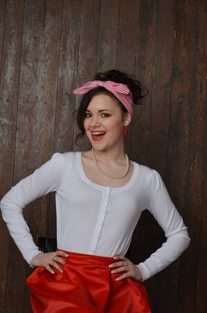 Girl in a red skirt and white blouse, vintageの写真素材
