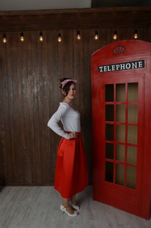 Girl in a red skirt and white blouse, vintageの写真素材
