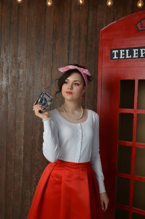 Girl in a red skirt and white blouse, vintageの写真素材