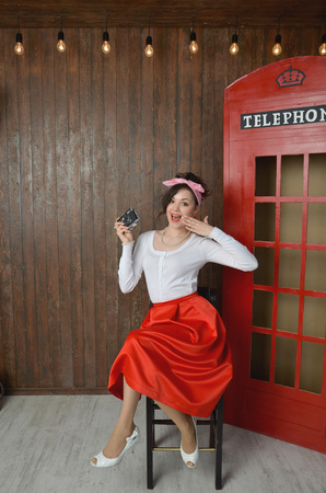 Girl in a red skirt and white blouse, vintageの写真素材
