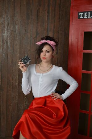 Girl in a red skirt and white blouse, vintageの写真素材