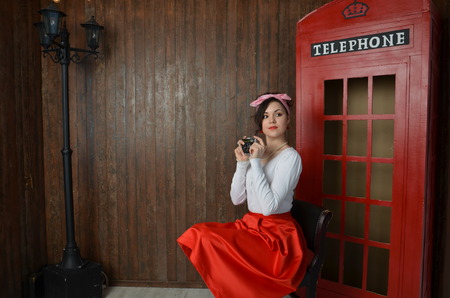 Girl in a red skirt and white blouse, vintageの写真素材