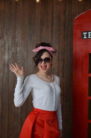 Girl in a red skirt and white blouse, vintageの写真素材
