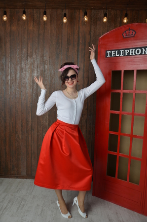 Girl in a red skirt and white blouse, vintageの写真素材
