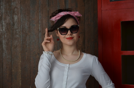 Girl in a red skirt and white blouse, vintageの写真素材