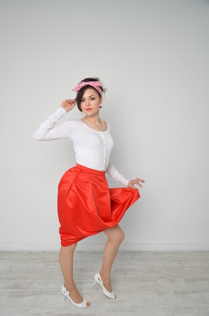 Girl in a red skirt and white blouse, vintageの写真素材