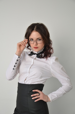 A girl in a strict business suitの写真素材