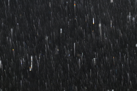 Raindrops on black glass on black glassの写真素材