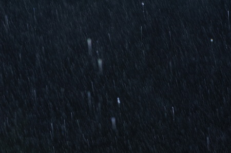 Raindrops on black glass on black glassの写真素材