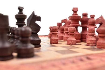 Wooden chess pieces on a chess board is unique