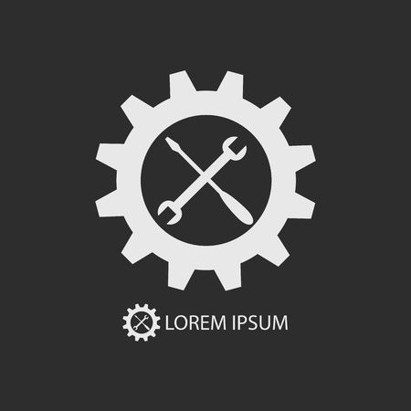 White gear wheel and tools as logo with copy space on dark grey backgroundのイラスト素材