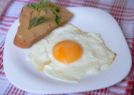 Breakfast - fried egg with pate sandwichの写真素材