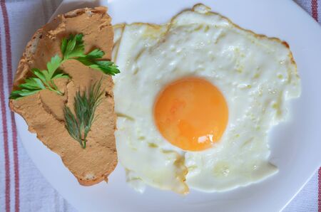 Breakfast - fried egg with pate sandwichの写真素材