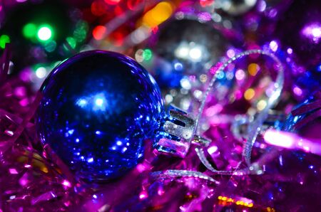 Small blue christmas ball with silver tinselの写真素材