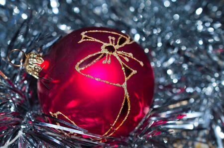 Red christmas ball with beautiful silver tinsellの写真素材