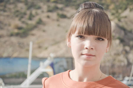 Portrait of beautiful young woman at the quayの写真素材