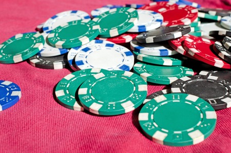 Background of Close up of different poker chipsの写真素材