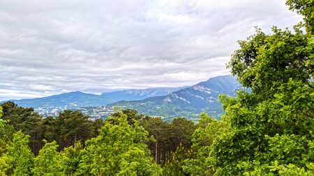 View on canyon, mountains and clouds over bue skyの写真素材