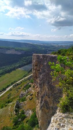 View on canyon, mountains and clouds over bue skyの写真素材