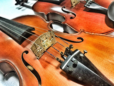 front side of violin in dramatic tone,abstract design,blurry light background,の写真素材