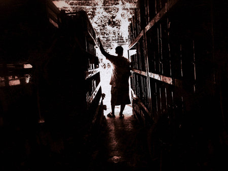 the abstract art of the canel ,the light at the end of canel,the back of human at the end,in dramatic tone,blurry light backgroundの写真素材