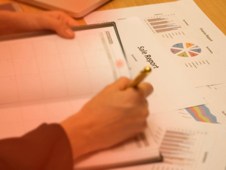 The paper work at office hour,investment chart and office work,busy hour work time of the business workerの写真素材
