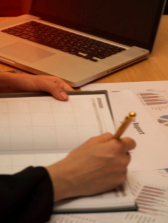 The paper work at office hour,investment chart and office work,busy hour work time of the business workerの写真素材