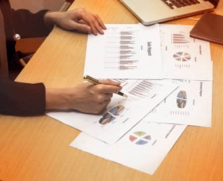 The paper work at office hour,investment chart and office work,busy hour work time of the business workerの写真素材