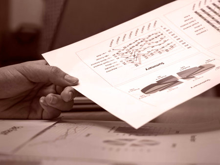 The paper work at office hour,investment chart and office work,busy hour work time of the business...