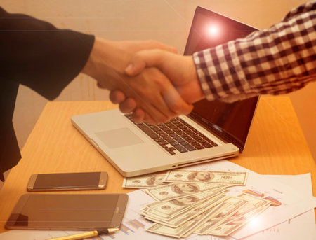 The blurry design of business worker making handshake ,success work,merger and acquisition...