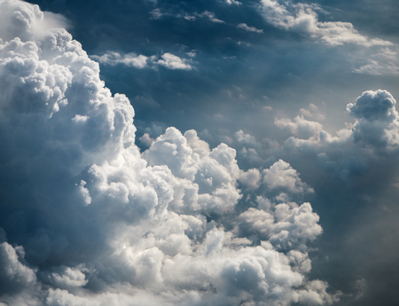 The sky bakground in Morning time,reflection of sunlight is shining to smoky waving cloud,cumulus cloud plenty of backgorund,before climate change,beautiful top view,beauty by nature.の写真素材