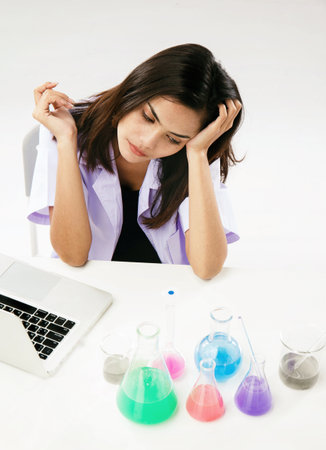 The chemist i,stress emotion,working by test tube with reagent in lab,raise her hand touch on...