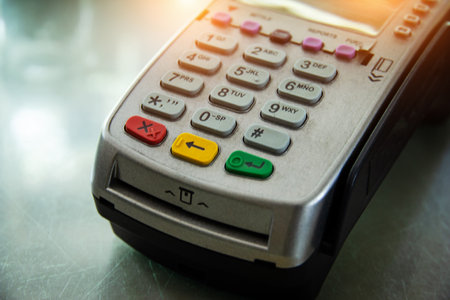 The blurry light design background of credit card machine,warm light tone.