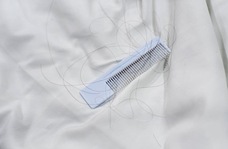Hair fall and white comb,put on background,