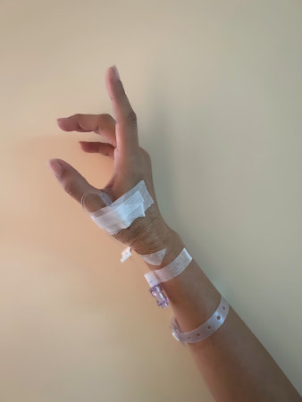 Hand with IV set,showing how to use the medical healing treatment with patientの写真素材
