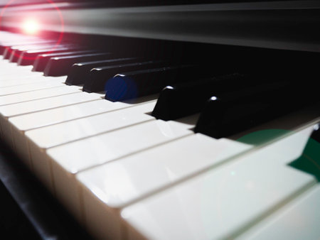 Blurred Black and white of Piano Keys,music instrument for practice,Lens flare effect.の写真素材