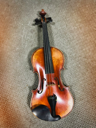 Front side of violin made from real wood panels,show detail of acoustic instrument.on backgroundの写真素材