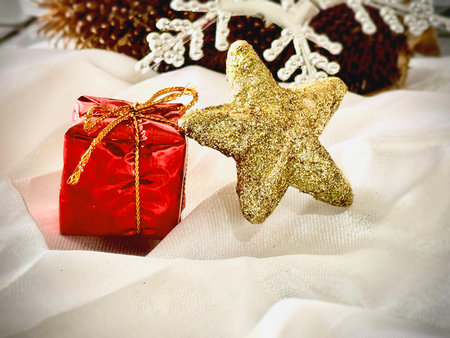 Present,Gift box put beside golden star,on background,sign and symbol of celebration and happy...