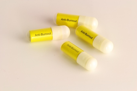 Four white and Yellwo Pills Against Burnoutの写真素材