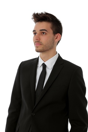 Handsome young man in black suit isolated on white - business conceptの写真素材
