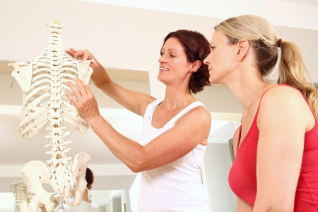 Professional physiotherapist explaining the shoulderの写真素材