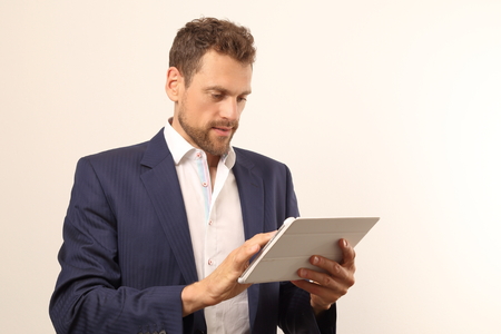A Modern business man with tablet PCの写真素材