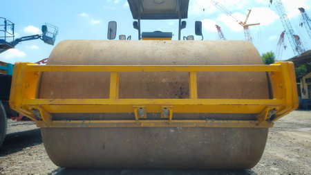 Vibratory roller is a soil compactor equipped with vibration heavy machinery for road and...