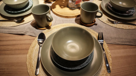 Dinning table set at home, tableware, glasses, spoon and fork.の写真素材