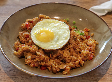 Authentic asian union fried rice and fried egg in a plate.の写真素材
