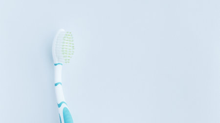 Blueish white toothbrush isolated on white.の写真素材