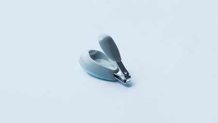Small gray fancy nail clipper isolated on white for baby or kid.の写真素材